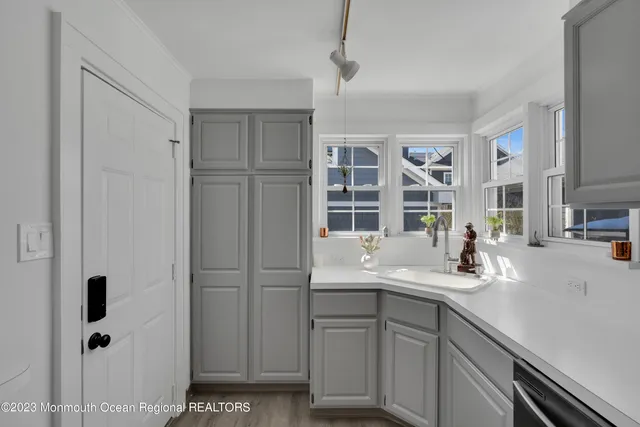 a kitchen with a sink and cabinets