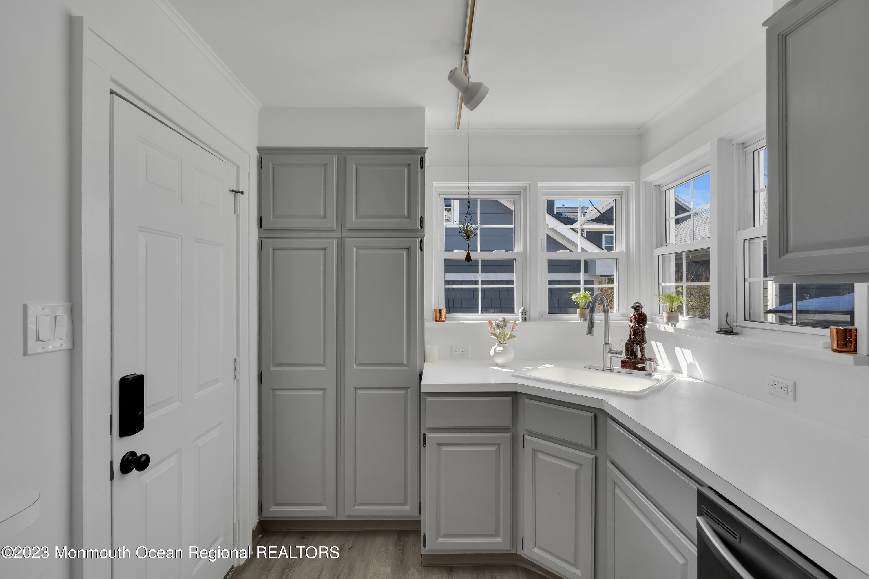 1107 5th Avenue Spring Lake, NJ 07762 - Photo 18 of 38 a kitchen with a sink and cabinets
