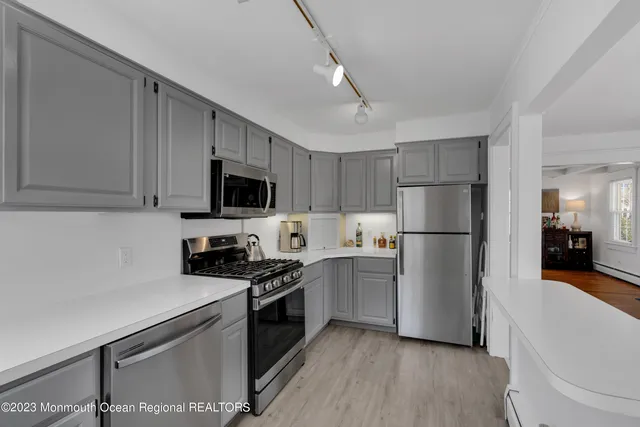 a kitchen with a sink a stove and refrigerator