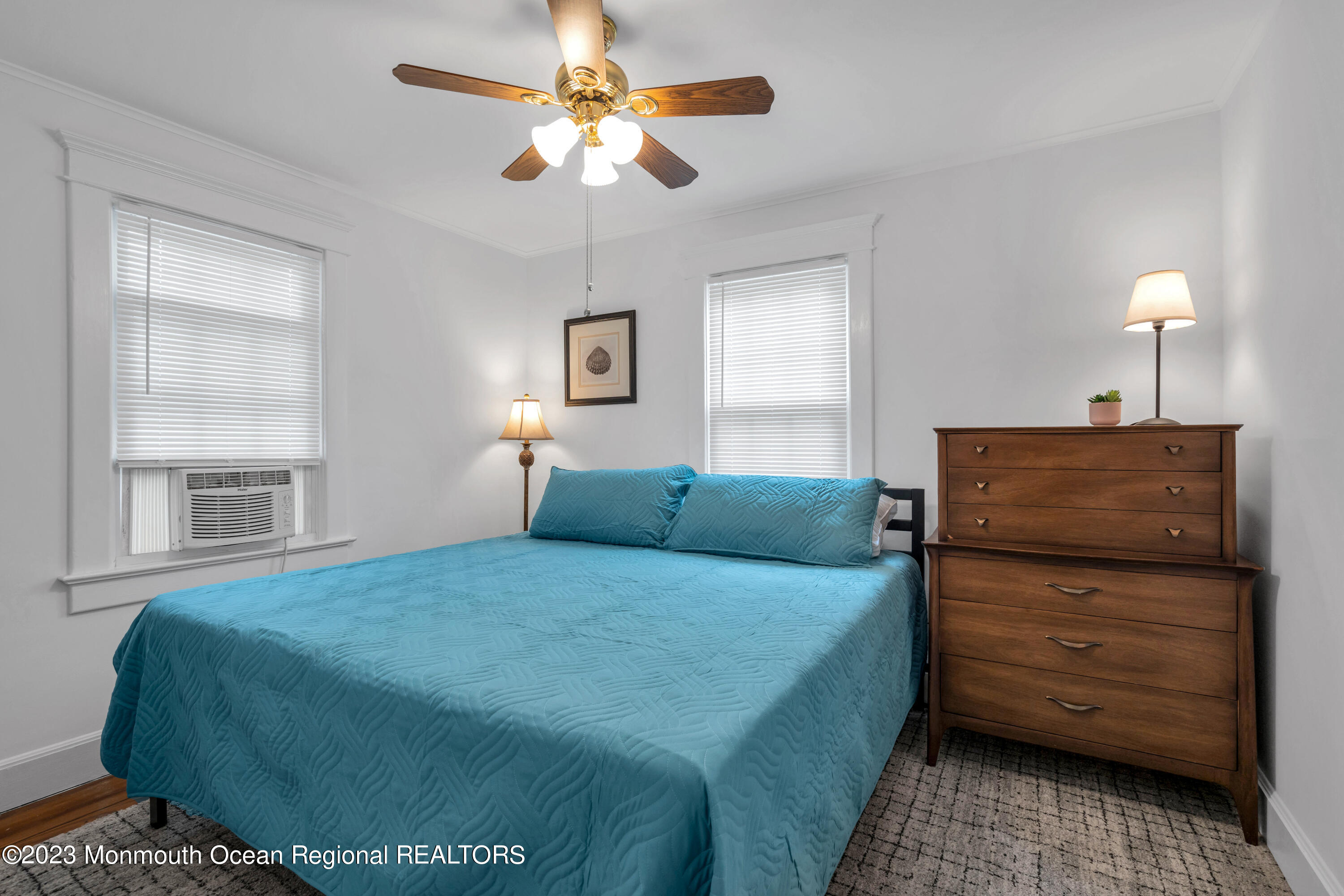 1107 5th Avenue Spring Lake, NJ 07762 - Photo 21 of 38 a bedroom with a bed and a dresser
