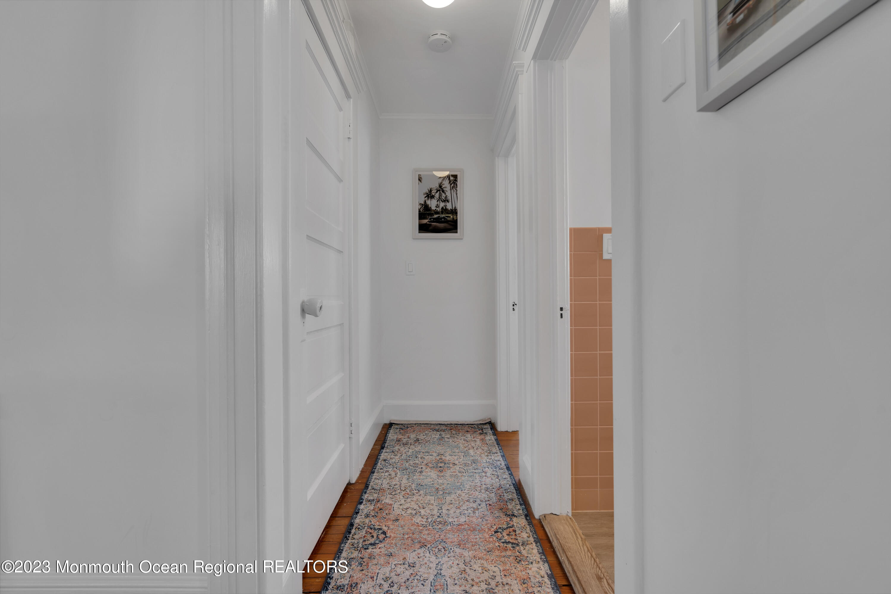 1107 5th Avenue Spring Lake, NJ 07762 - Photo 26 of 38 a view of a hallway with wooden floor and closet