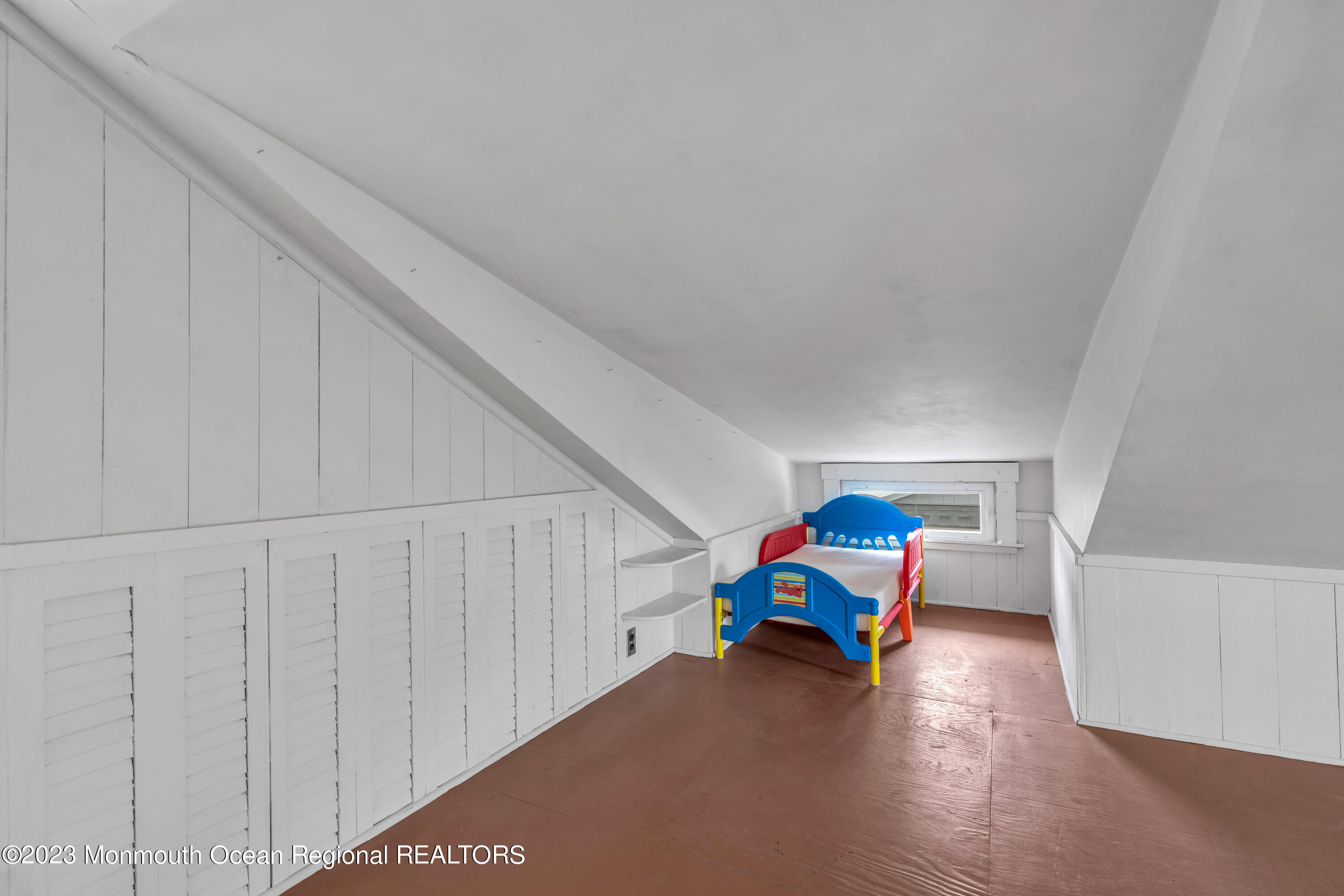 1107 5th Avenue Spring Lake, NJ 07762 - Photo 31 of 38 a children room with toys and wooden floor