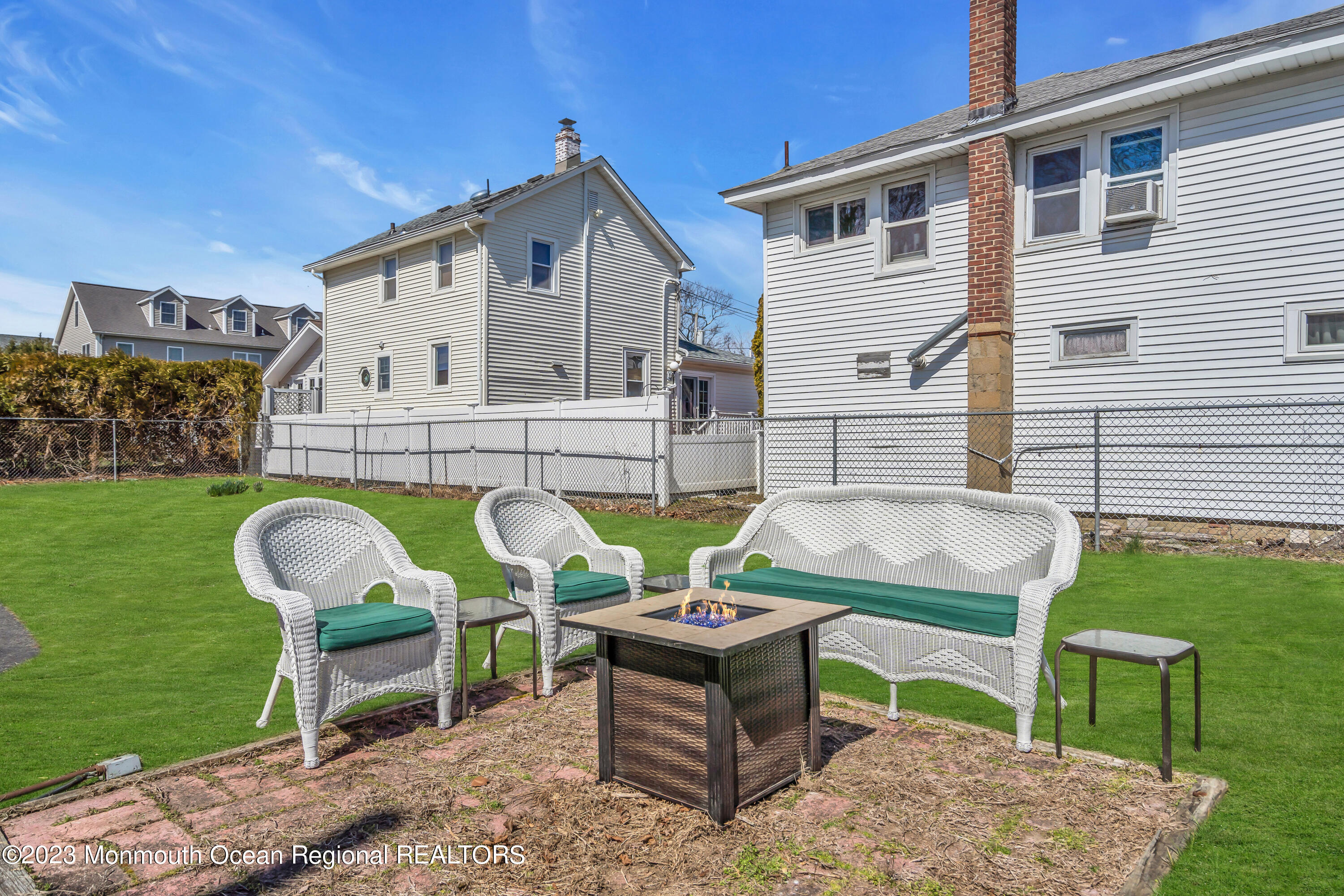 1107 5th Avenue Spring Lake, NJ 07762 - Photo 35 of 38 a backyard of a house with table and chairs