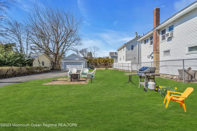 a view of a house with a yard porch and sitting area