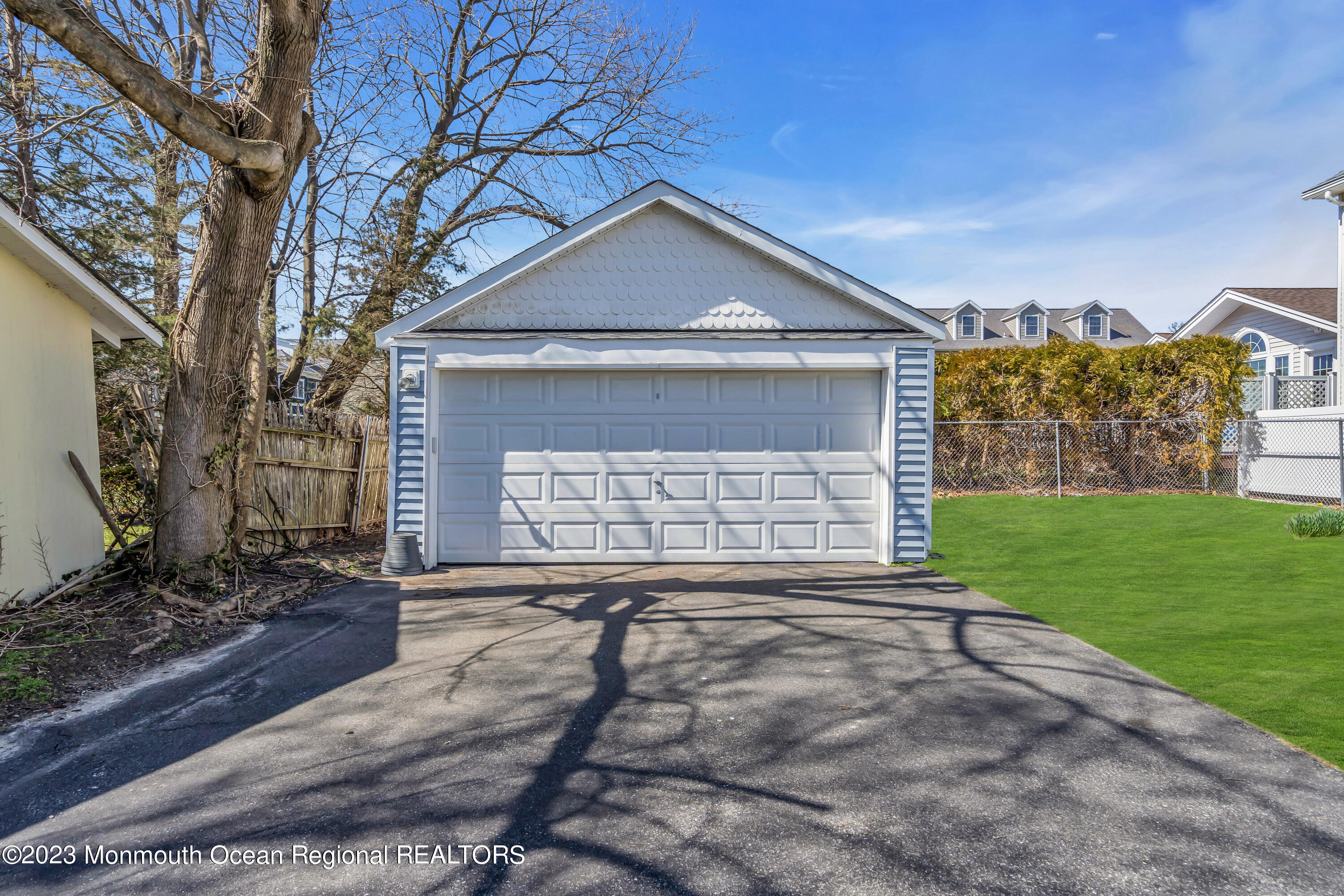 1107 5th Avenue Spring Lake, NJ 07762 - Photo 37 of 38 a front view of a house with yard