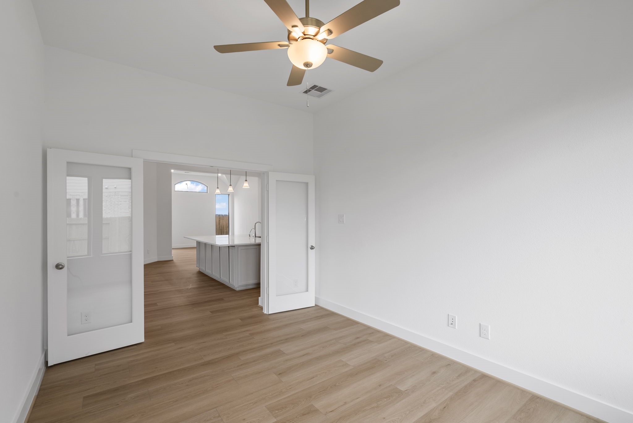 18806 Forested Street Manvel, TX 77578 - Photo 11 of 35 wooden floor in an empty room with a window
