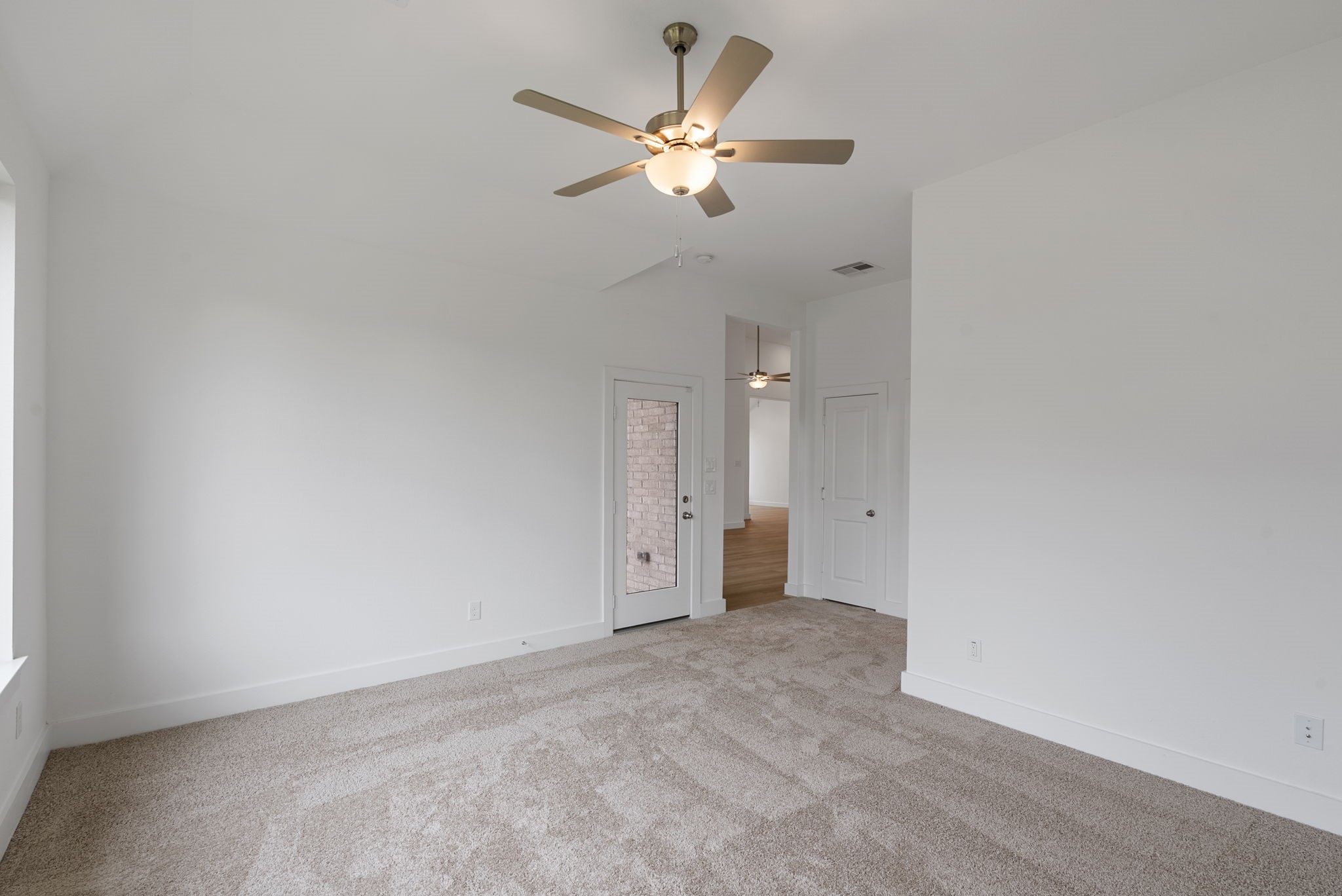 18806 Forested Street Manvel, TX 77578 - Photo 20 of 35 an empty room with chandelier fan and closet