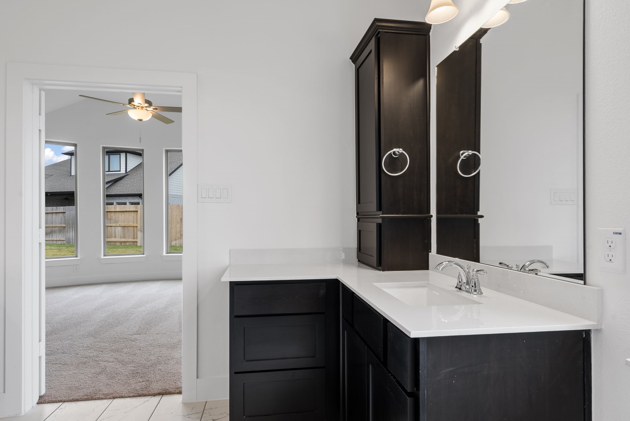 18806 Forested Street Manvel, TX 77578 - Photo 21 of 35 a bathroom with a sink vanity and a mirror