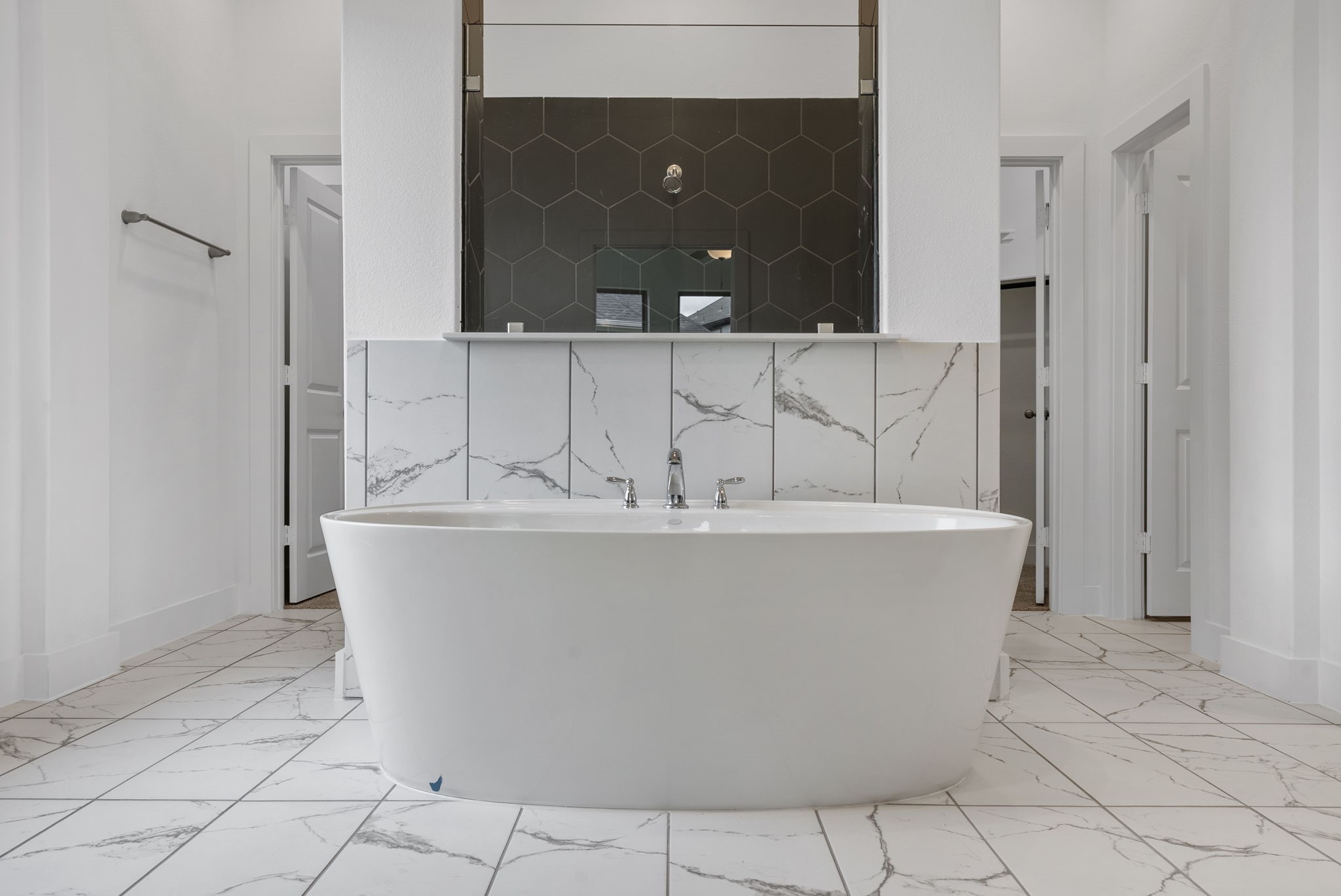18806 Forested Street Manvel, TX 77578 - Photo 23 of 35 a white bath tub sitting in a bathroom