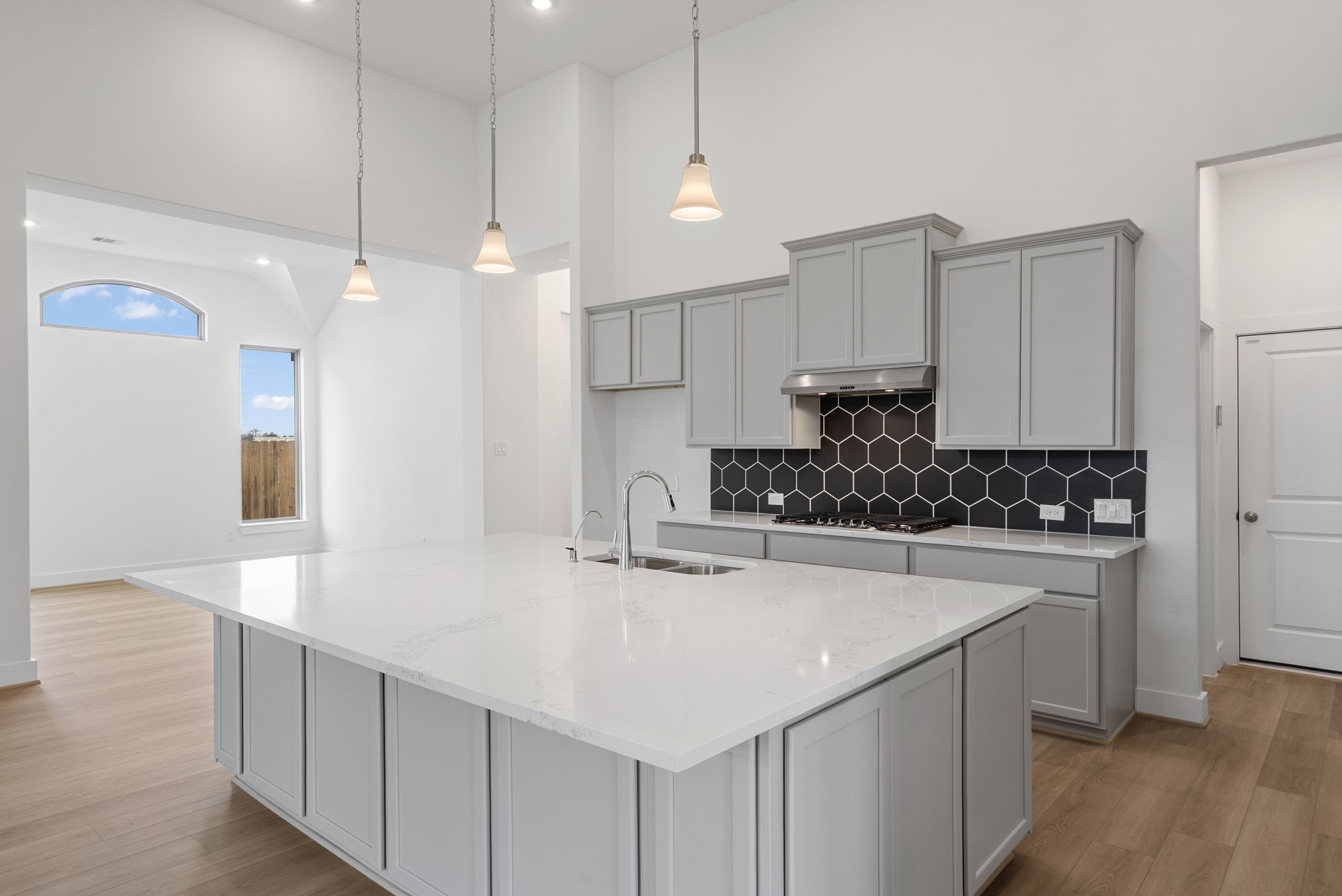 18806 Forested Street Manvel, TX 77578 - Photo 5 of 35 a kitchen with kitchen island a sink stainless steel appliances and cabinets