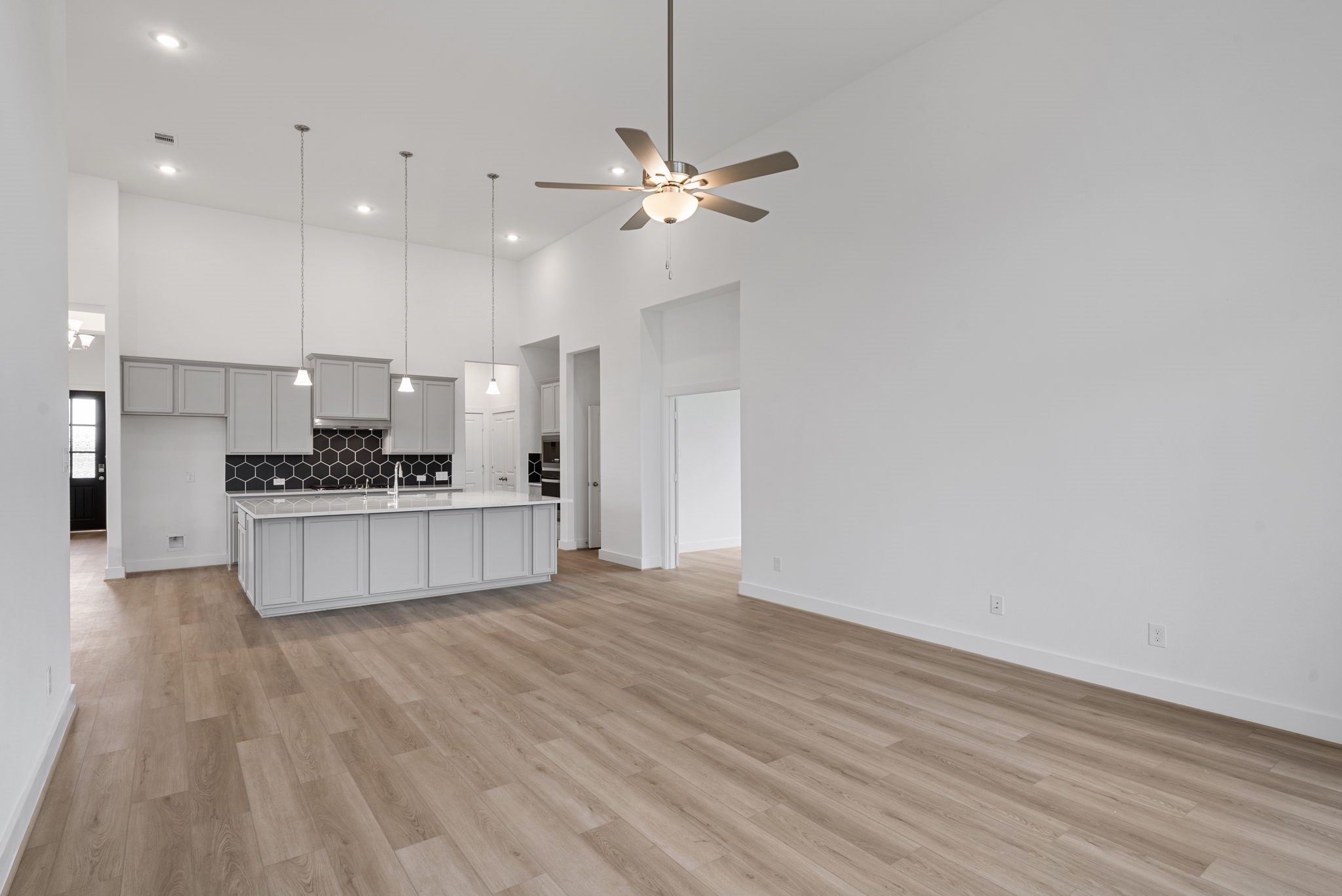 18806 Forested Street Manvel, TX 77578 - Photo 8 of 35 a view of kitchen with kitchen island white cabinets and stainless steel appliances
