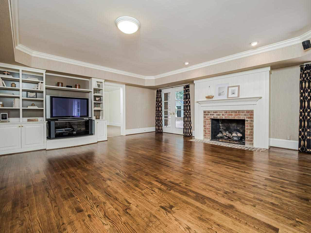 1913 Lewis Circle Raleigh, NC 27608 - Photo 27 of 30 Lower Level Bonus Room Has Access to Back Patio from Two Sets Of Double Doors Lower Level Bonus Room
