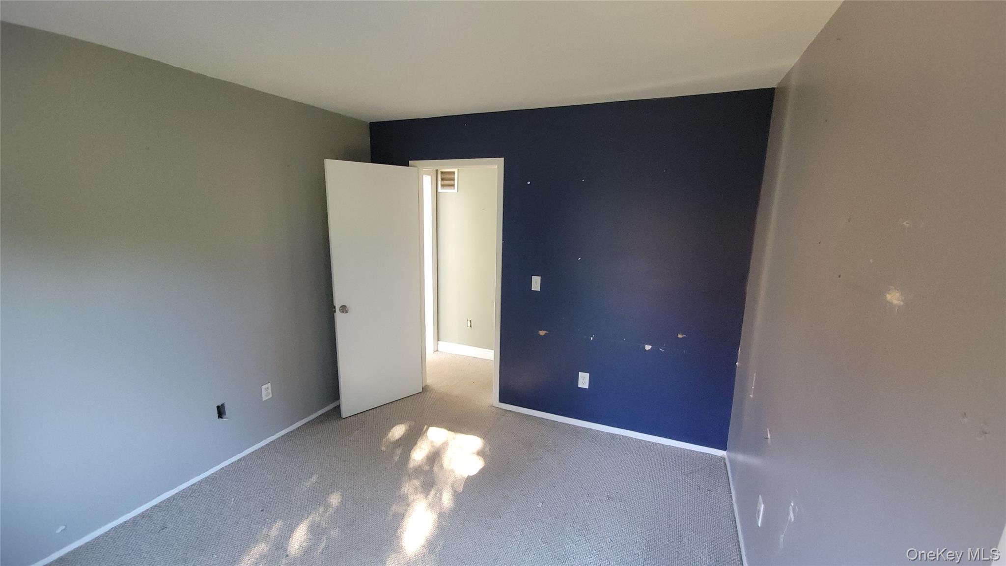 35 Gibbs Road, Unit 22 Coram, NY 11727 - Photo 11 of 20 Carpeted spare room featuring baseboards