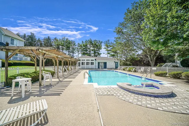 a view of a swimming pool with a patio