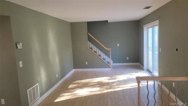 a view of a hallway view with staircase