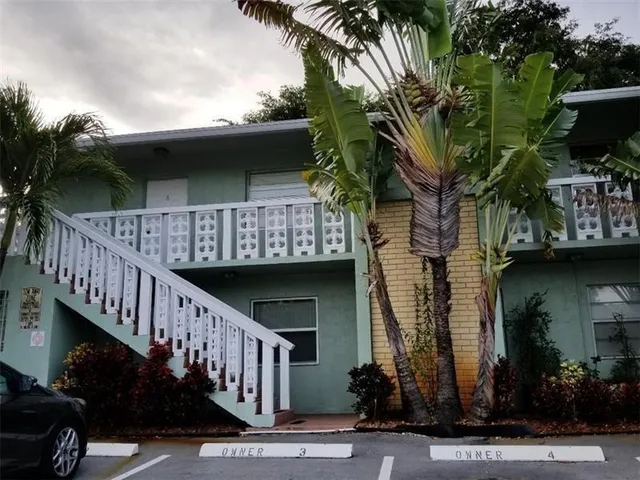 a view of an empty room with a fireplace