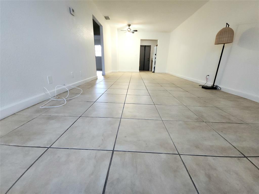2607 Northeast 8th Avenue, Unit 7 Wilton Manors, FL 33334 - Photo 15 of 30 a view of an empty room with a fireplace