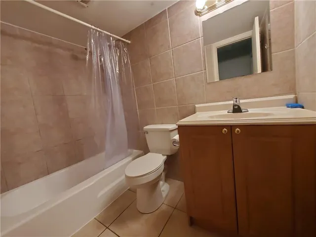 a view of a livingroom and a bathroom