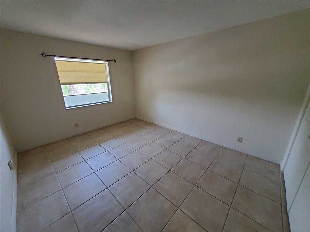 2607 Northeast 8th Avenue, Unit 7 Wilton Manors, FL 33334 - Photo 5 of 30 an empty room with windows