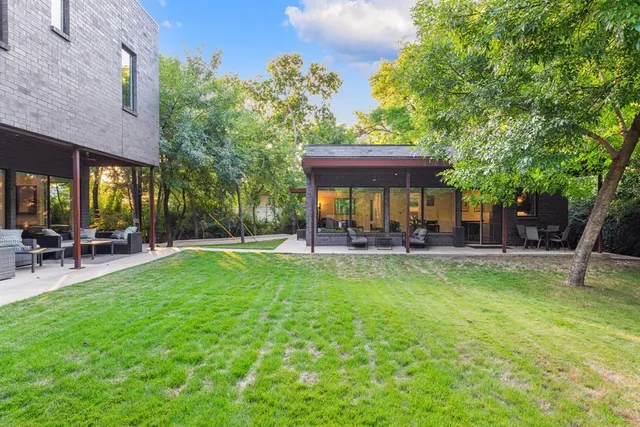 a view of a backyard with sitting area