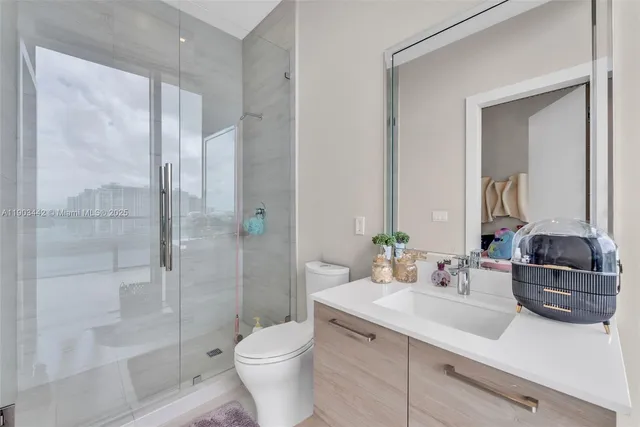 a living room with furniture tv and large window