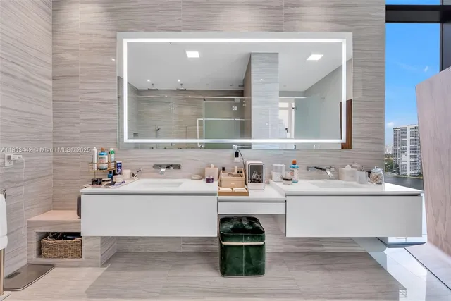 a bathroom with a bathtub and a shower