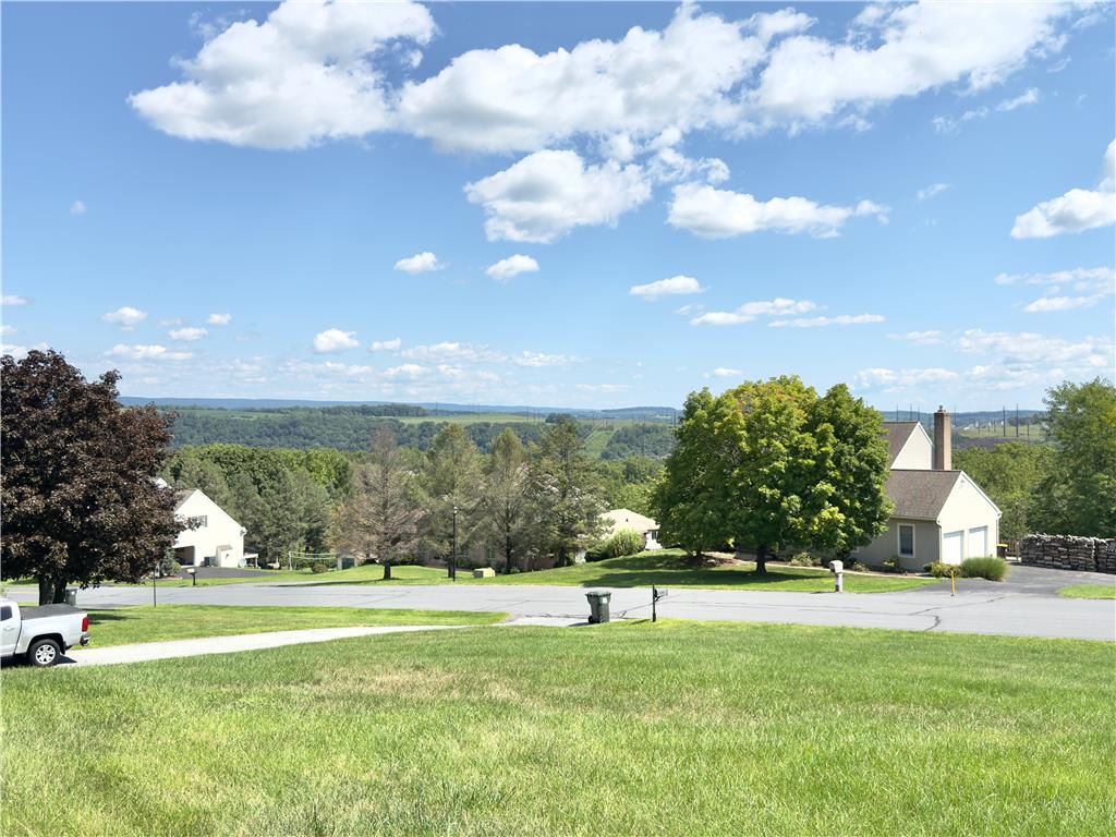 4982 Abbey Road Coplay, PA 18037 - Photo 3 of 55 Lush green hillsides and distant valley ridges create a peaceful backdrop under blue skies.