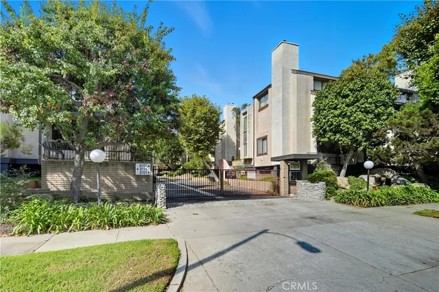 a view of a patio with couches and potted plants