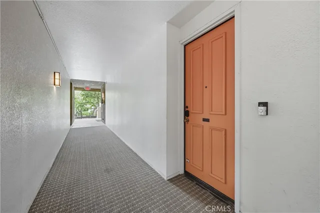 a view of hallway with window and front door