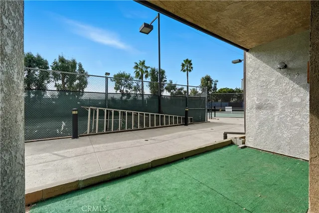 a view of a deck with a big yard