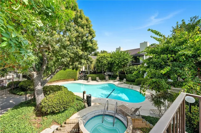 a view of a swimming pool with a yard