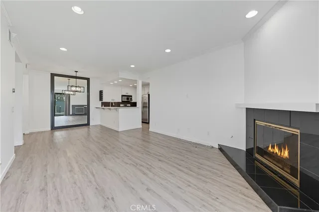 a view of a kitchen with a sink and a stove top oven