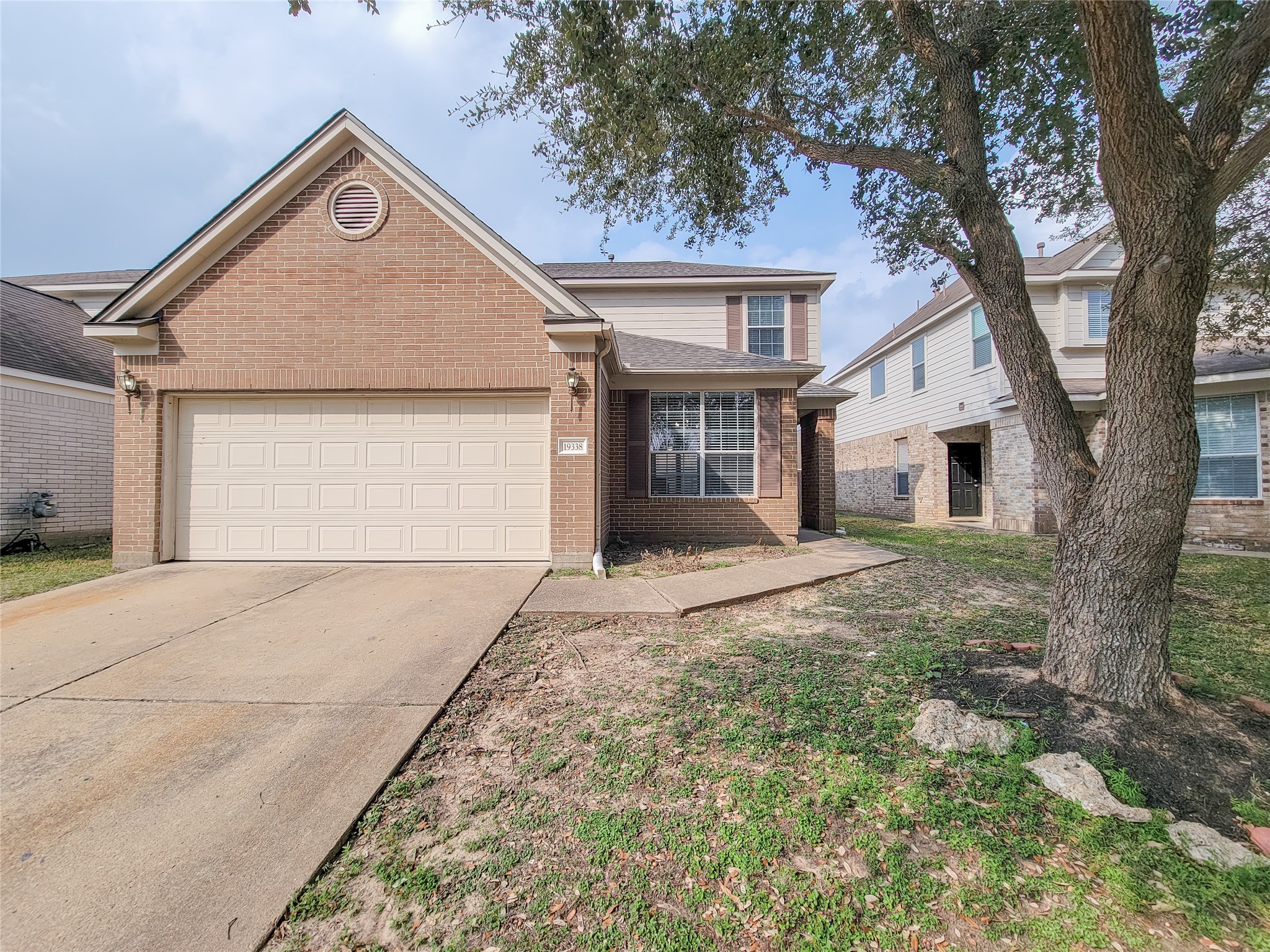 19338 Harvest Stream Way Houston, TX 77084 - Photo 1 of 49 a front view of a house with a yard and garage