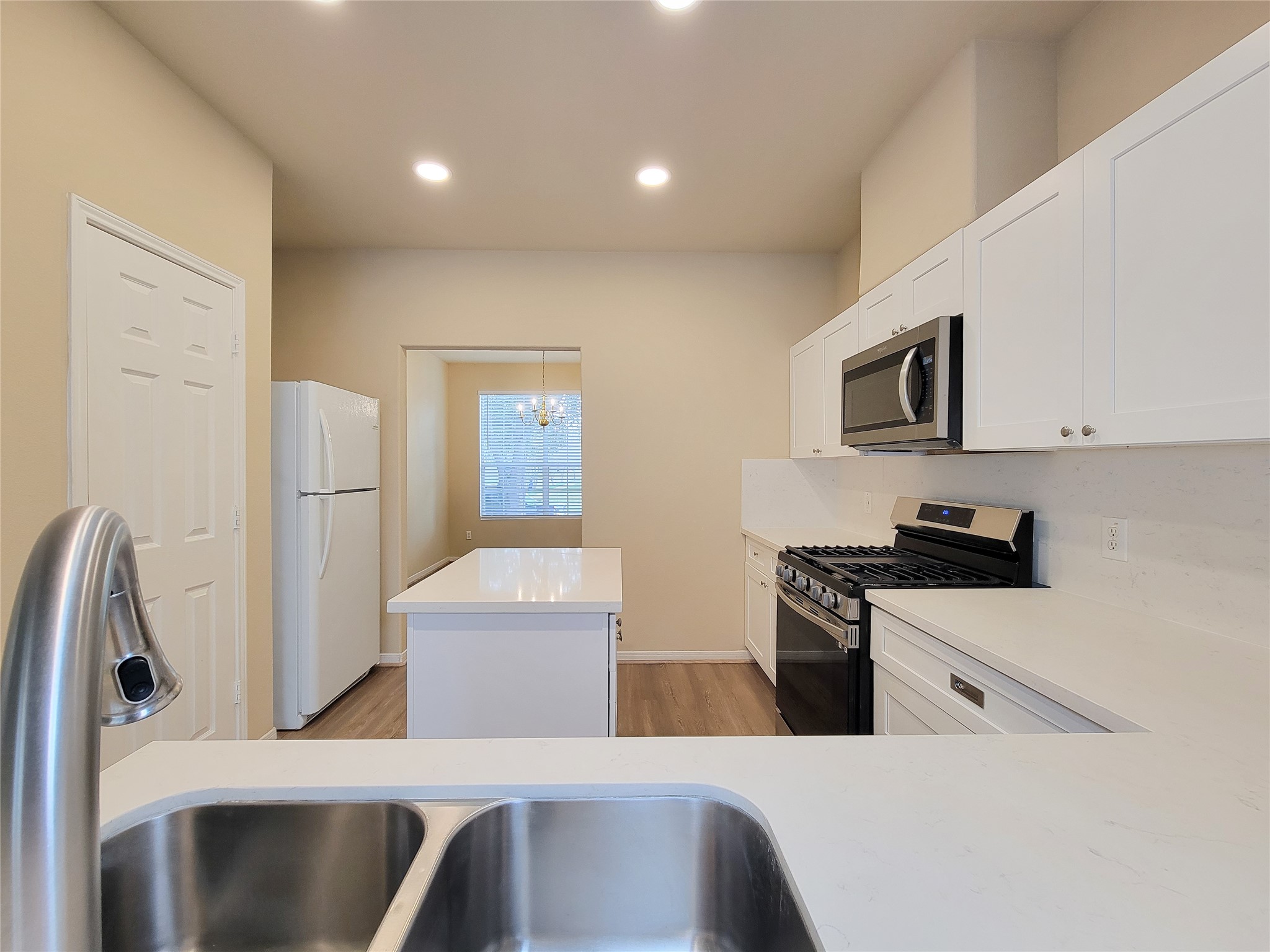 19338 Harvest Stream Way Houston, TX 77084 - Photo 13 of 49 a kitchen with stainless steel appliances granite countertop a refrigerator and a stove top oven