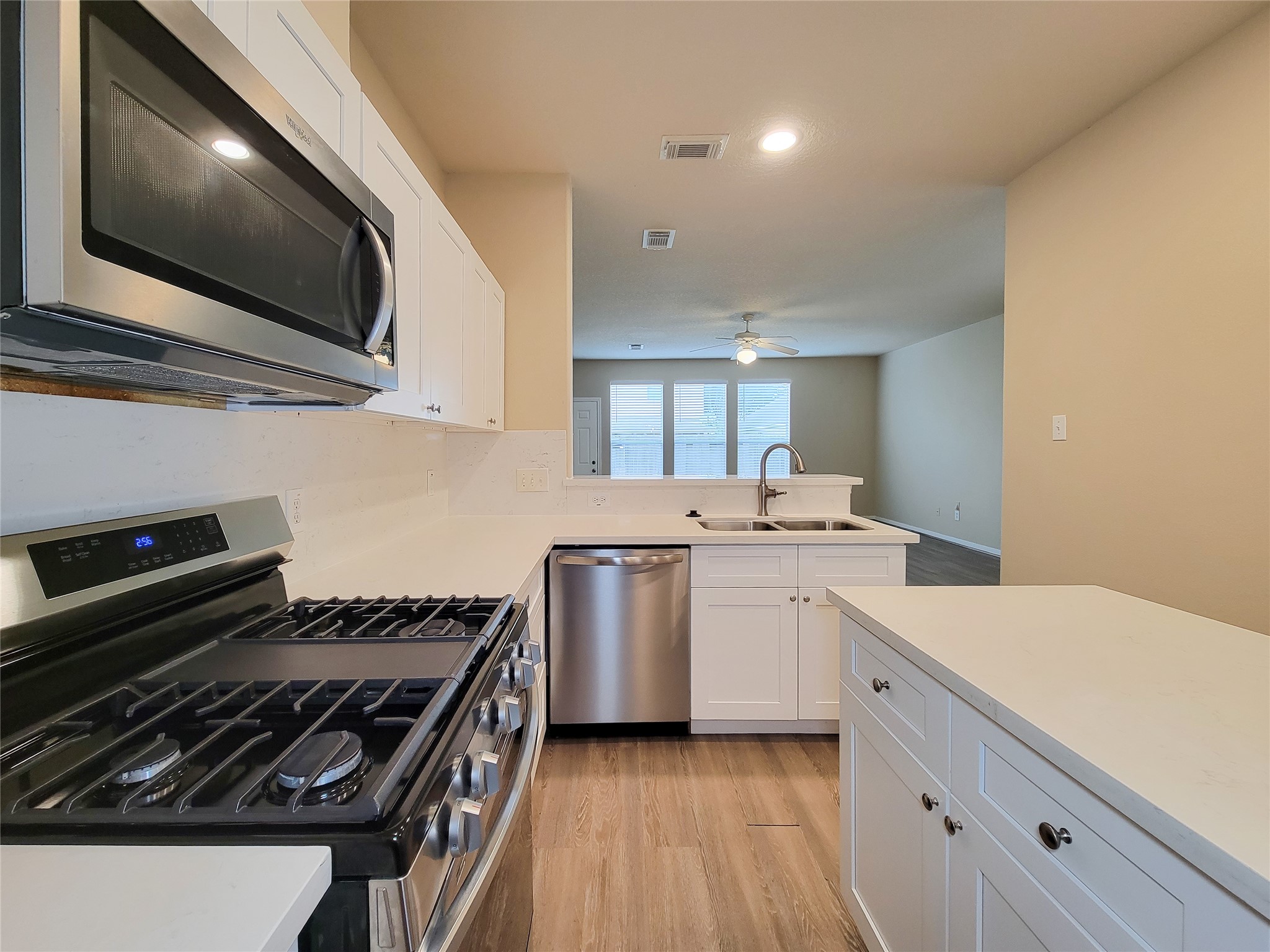 19338 Harvest Stream Way Houston, TX 77084 - Photo 17 of 49 a kitchen with a stove and a microwave