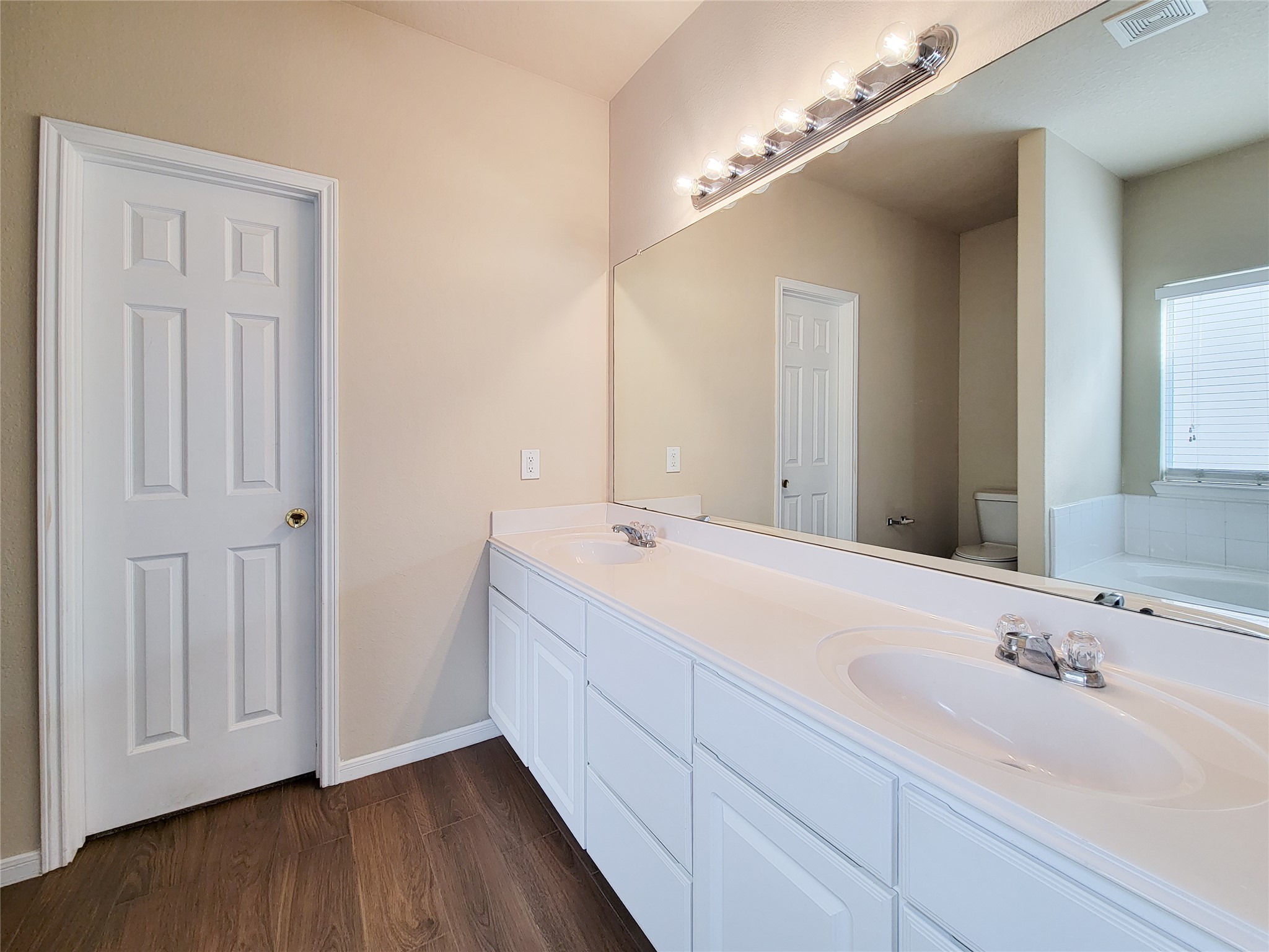 19338 Harvest Stream Way Houston, TX 77084 - Photo 28 of 49 a bathroom with a double vanity sink and a mirror