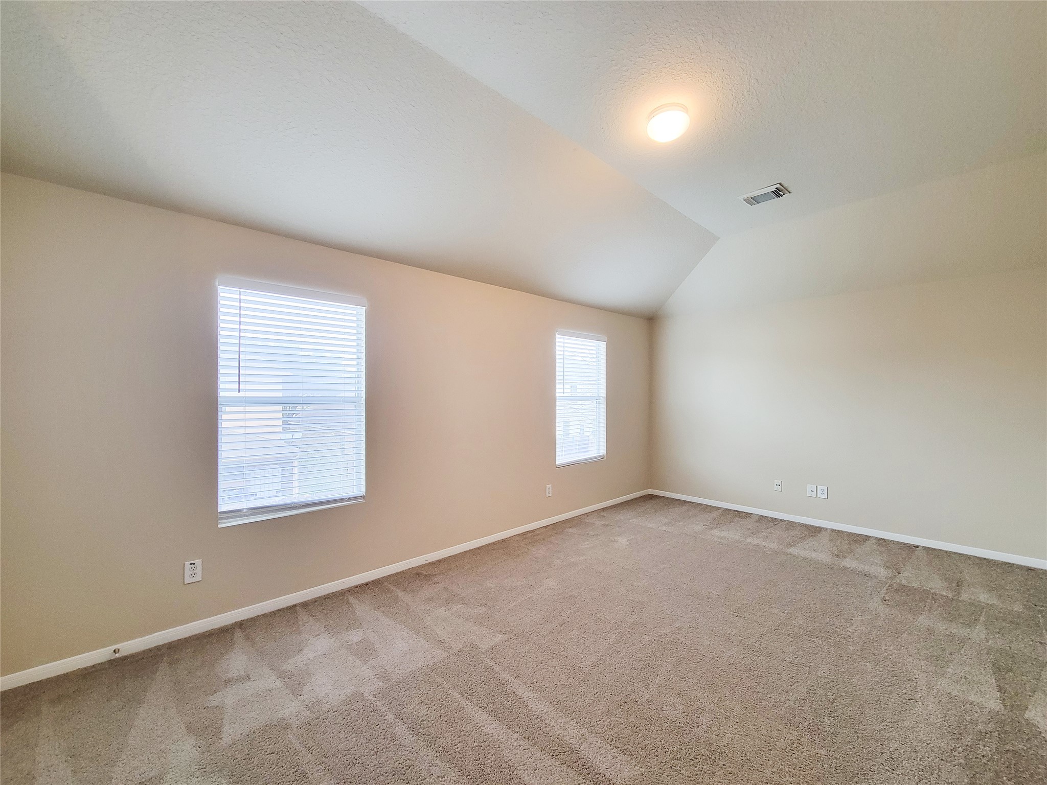 19338 Harvest Stream Way Houston, TX 77084 - Photo 34 of 49 an empty room with windows
