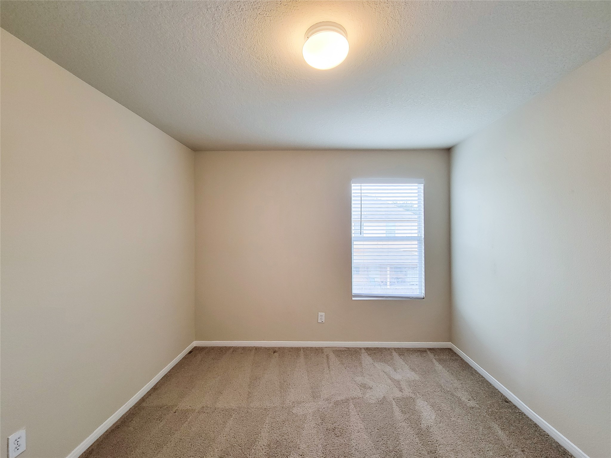 19338 Harvest Stream Way Houston, TX 77084 - Photo 37 of 49 an empty room with a window