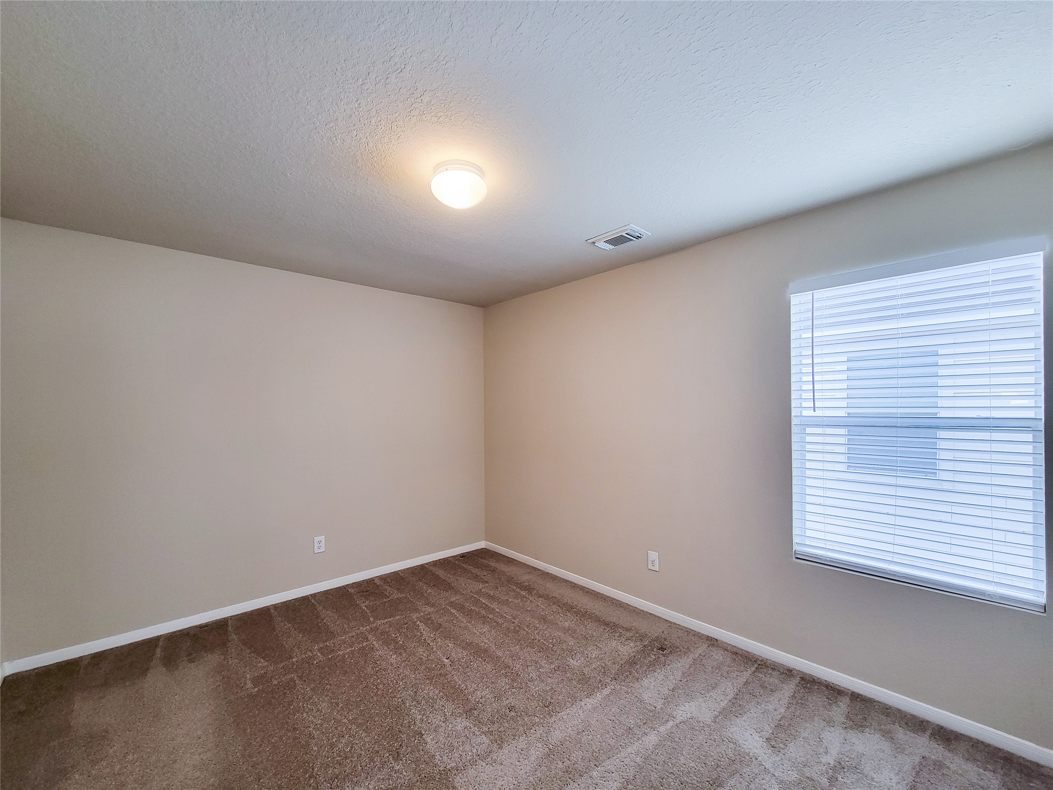 19338 Harvest Stream Way Houston, TX 77084 - Photo 39 of 49 an empty room with a window