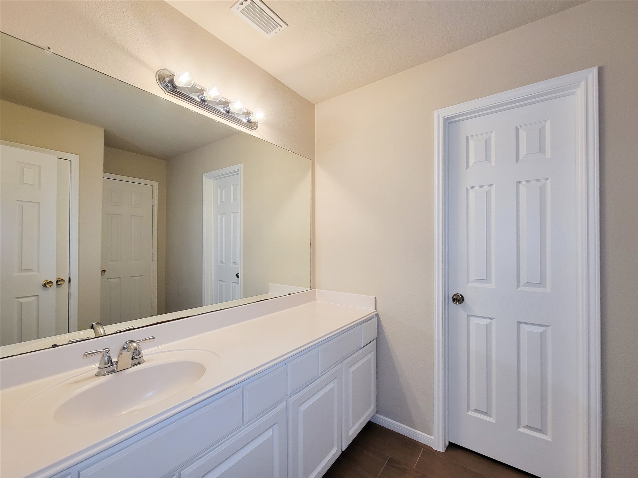 19338 Harvest Stream Way Houston, TX 77084 - Photo 46 of 49 a bathroom with a double vanity sink and a mirror