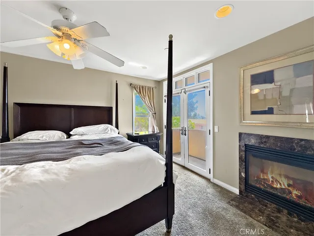 a bedroom with a bed and a fireplace