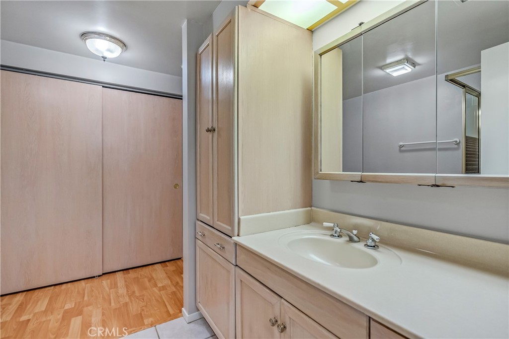 5544 Wentworth Drive Riverside, CA 92505 - Photo 14 of 29 a bathroom with a sink and a mirror