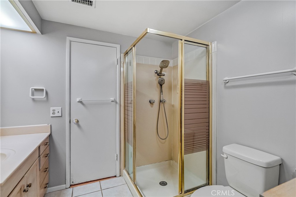 5544 Wentworth Drive Riverside, CA 92505 - Photo 15 of 29 a bathroom with a shower and toilet