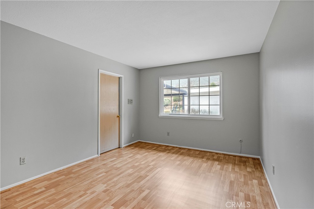 5544 Wentworth Drive Riverside, CA 92505 - Photo 16 of 29 wooden floor in an empty room with a window