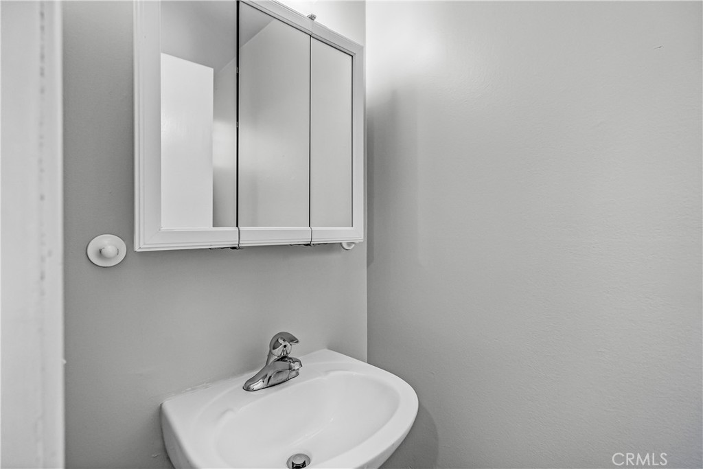 5544 Wentworth Drive Riverside, CA 92505 - Photo 18 of 29 a bathroom with a sink and mirror