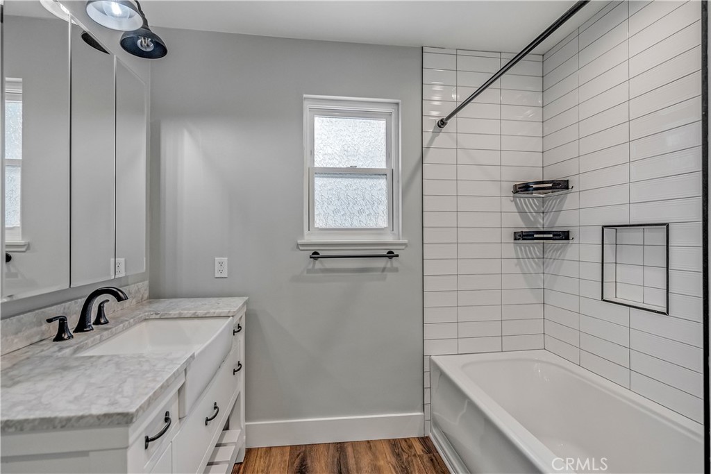 5544 Wentworth Drive Riverside, CA 92505 - Photo 19 of 29 a bathroom with a granite countertop sink a toilet and shower