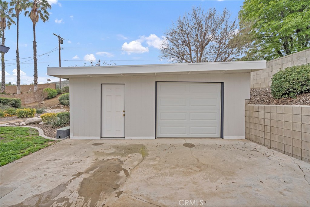 5544 Wentworth Drive Riverside, CA 92505 - Photo 21 of 29 a front view of a house with a yard and garage