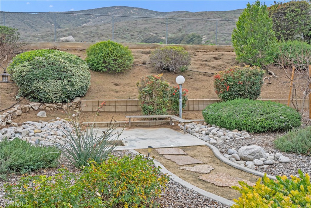 5544 Wentworth Drive Riverside, CA 92505 - Photo 24 of 29 a view of a garden with a pathway