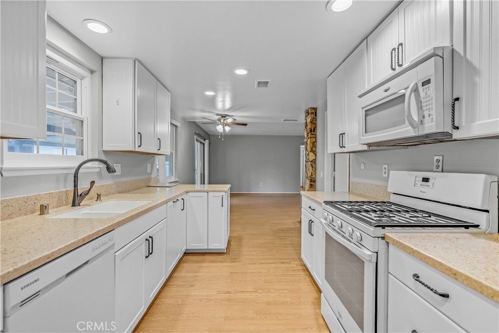 5544 Wentworth Drive Riverside, CA 92505 - Photo 6 of 29 a kitchen with granite countertop a sink stove and cabinets