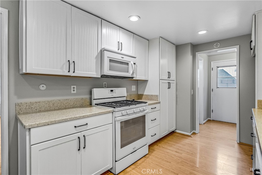 5544 Wentworth Drive Riverside, CA 92505 - Photo 8 of 29 a kitchen with stainless steel appliances granite countertop a stove a sink and a refrigerator
